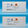 Two white cardboard boxes with white labels that contain blue text that reads "Organic contaminants in smokers' urine" One box displays Standard reference material 3672a and other 3673a